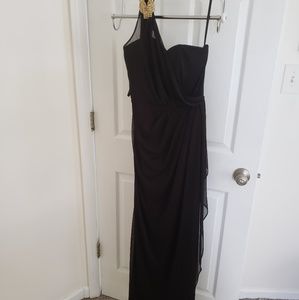 A Black Dress With Gold Embellishments